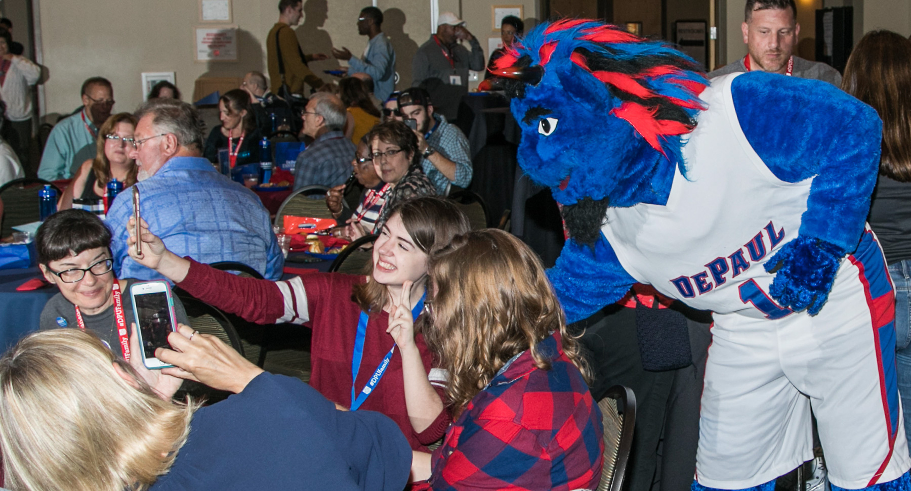 DIBS poses with guests at the Family Weekend Kickoff celebration. Student groups performed for the guests during a buffet dinner that started the weekend of festivities. (DePaul University/Jamie Moncrief)